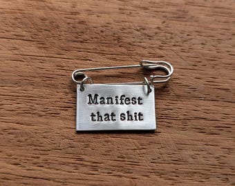 Manifest that shit Kilt Pin Brooch ~ Hand Stamped Badge ~ Manifestation, Motivational, Affirmation, Positivity, Mental Heath Jewelry Gift