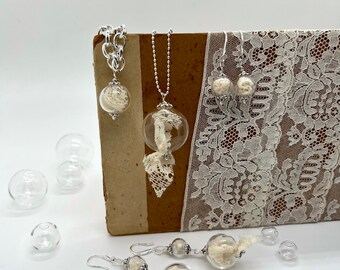 embroidery set lace and glass bubbles fragments of author