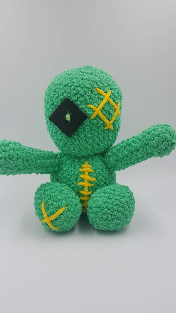 green voodoo doll