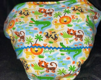 ABDL Waddle Diaper Spread Diaper nursery rhymes in lions and tigers in a jungle setting for ABDL the AdorableSissie in you