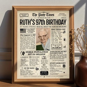 May include: A framed print designed as a vintage newspaper, "The Party Times", marking Ruth's 97th birthday. The design includes a photo, facts from 1929, and the cost of items like a new car (£133.00).