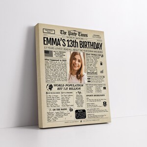 May include: A canvas print designed to resemble a vintage newspaper front page. The headline reads "EMMA'S 13th BIRTHDAY" with a photo of a smiling person. The print includes details about the year Emma was born, such as world population and popular games.
