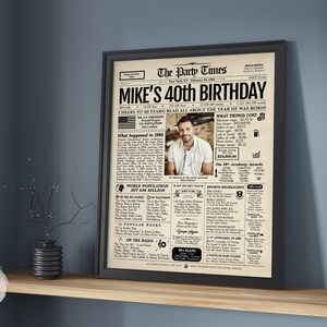 May include: A framed poster titled The Party Times, designed as a vintage newspaper front page for a 40th birthday. It features a central photograph of a person, historical facts from 1986, cost of living data, and sections on popular culture.
