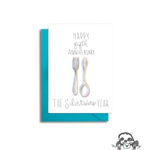 May include: A white card with a blue envelope. The card has black text that says "Happy fifth anniversary The silverware year". There is a drawing of a fork and spoon in the center of the card.
