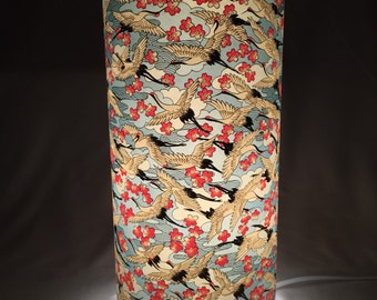 Table or floor lamp 34 cm high 15 cm wide. Handmade with hand silkscreen printed Japanese chiyogami paper
