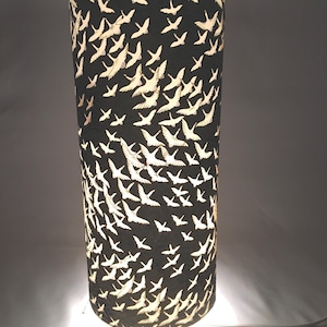 Table or floor lamp 34 cm high 15 cm wide. Handmade with hand silk screen printed Japanese chiyogami paper.