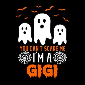 May include: A black and white graphic design with three ghosts and the text "You can't scare me I'm a Gigi" with orange spiderwebs on either side of the text.