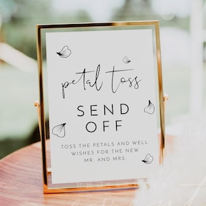 Peut inclure: Une pancarte blanche dans un cadre doré avec du texte noir qui dit "petal toss send off toss the petals and well wishes for the new mr. and mrs."