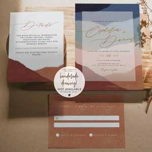 May include: Wedding invitation suite with a modern abstract design. The invitation features a blue, pink, and brown watercolor background with the couple's names in gold script. The RSVP card is a brown rectangle with a white RSVP section and a white circle for accepting or declining the invitation.