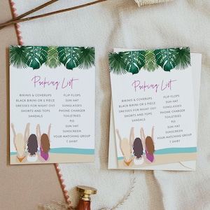May include: Two packing list cards with a tropical leaf design. The cards list items like bikinis, dresses, and sandals. The cards have illustrations of women on a beach. A wooden handled wax stamp is in the foreground.