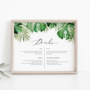 Peut inclure: Un menu de boissons de mariage imprimable sur le thème tropical. Le menu présente une illustration aquarelle de feuilles de palmier vertes et le mot "Drinks" en écriture manuscrite. Le menu liste la bière, le vin, les spiritueux et un cocktail signature.