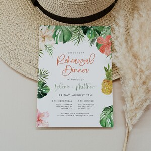 May include: A tropical-themed rehearsal dinner invitation with a watercolour design of palm leaves, pineapples, and hibiscus flowers. The invitation reads "Join us for a Rehearsal Dinner in honour of Lalanie & Matthew, Friday, August 7th, 5 PM Rehearsal, Violetta Manor, 1635 Maxwell St, Denver, CO, 7 PM Dinner, Willow Kitchen, 345 Broadway, Denver, CO. Regrets only to Maddison, 303-123-5468 or M James@gmail.com"