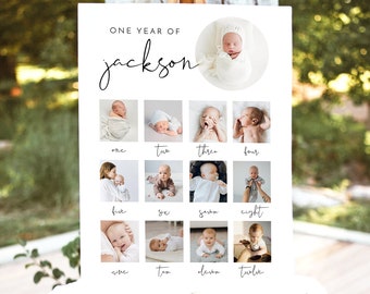 May include: A white poster board with the text "ONE YEAR OF jackson" at the top. The poster board is divided into twelve squares, each containing a photo of a baby at a different age. The photos are arranged in chronological order, with the baby's age written below each photo.