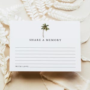 May include: A white card with the text "SHARE A MEMORY" and "WITH LOVE," printed in black. A watercolor illustration of a palm tree is at the top. The card has horizontal lines for writing and is surrounded by white foliage.