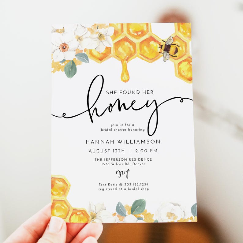 May include: A white bridal shower invitation with a honeybee and honeycomb design. The text reads "She found her honey" and includes the bride's name, date, time, and location. RSVP information is also included.