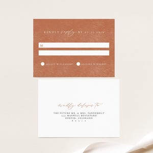 May include: A rust-colored RSVP card with white text. The card has two lines for a name, a circle to check "Accept w/Pleasure" or "Decline w/Regret", and the date "07-11-2019". A white envelope with a rust-colored handwritten address reads "kindly deliver to THE FUTURE MR. & MRS. VANDERBILT 1532 MAXWELL BOULEVARD DENVER, COLORADO 80210"