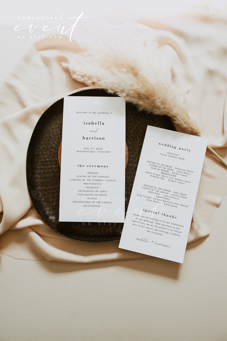 May include: A wedding ceremony program with a simple, modern design. The program lists the order of events for the ceremony, including the seating of the families, lighting of the wedding candles, readings, exchanging of vows, exchanging of rings, prayer, presentation of the couple, and recessional. The program also includes a list of the wedding party and a special thanks section.