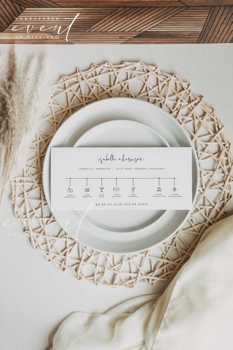 May include: A white card with black text and icons outlining the schedule for a wedding. The card reads "isabella + harrison", "ISABELLA + HARRISON", "08.07.30XX", "DENVER, COLORADO", and "WE'RE SO GLAD YOU'RE HERE!"