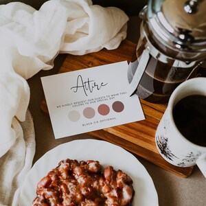 May include: A white card with the word "Attire" written in black cursive. The card also includes a colour palette with four shades of brown and the text "We kindly request our guests to wear these colours to our special day. Black-tie optional."