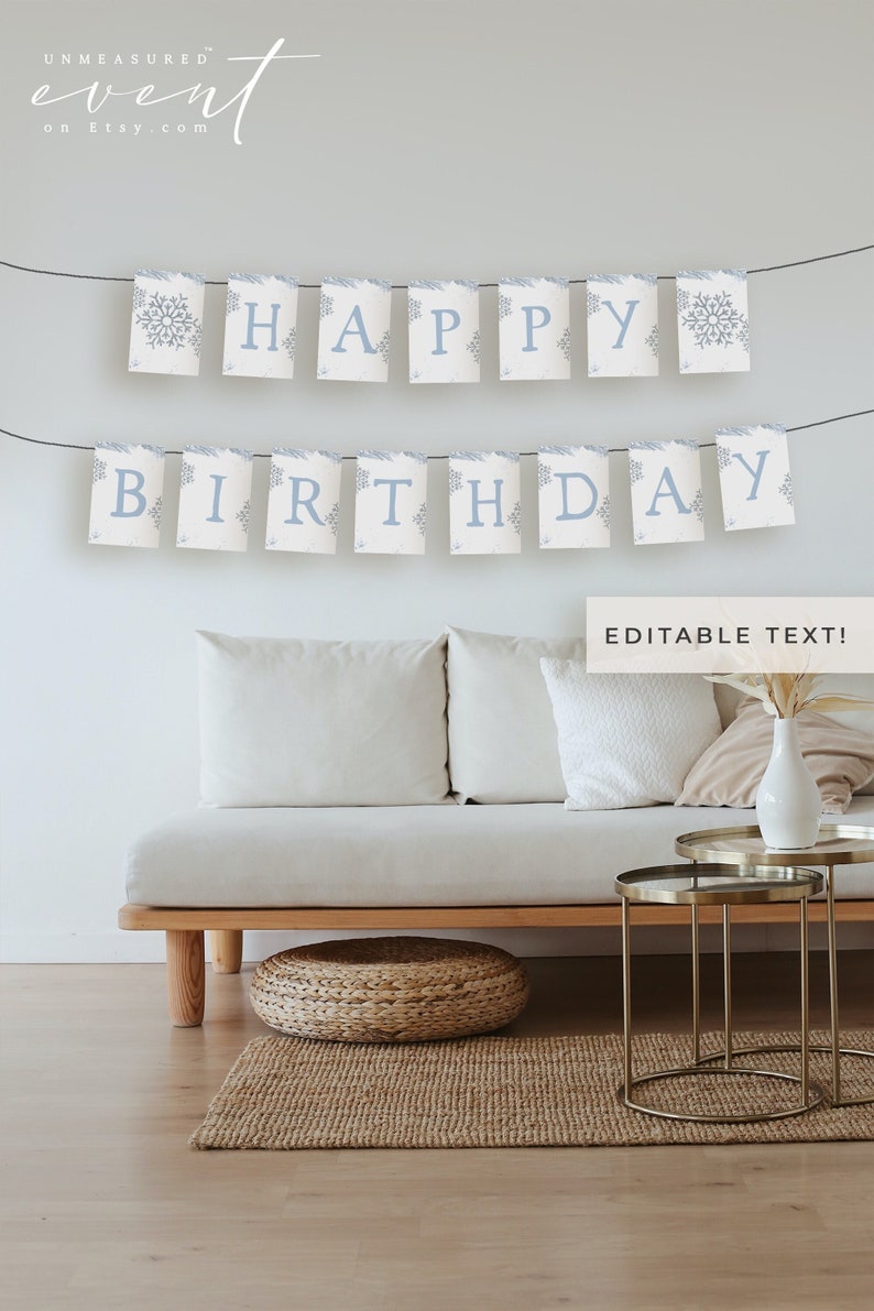 May include: A 'HAPPY BIRTHDAY' banner in light blue, with snowflake motifs, strung across a room. The banner hangs above a white sofa and a small table. The words 'EDITABLE TEXT!' are also visible in the image.