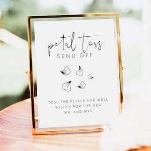 Peut inclure: Une pancarte blanche avec du texte noir et des illustrations florales dans un cadre doré. La pancarte indique "petal toss send off" et "toss the petals and well wishes for the new mr. and mrs."