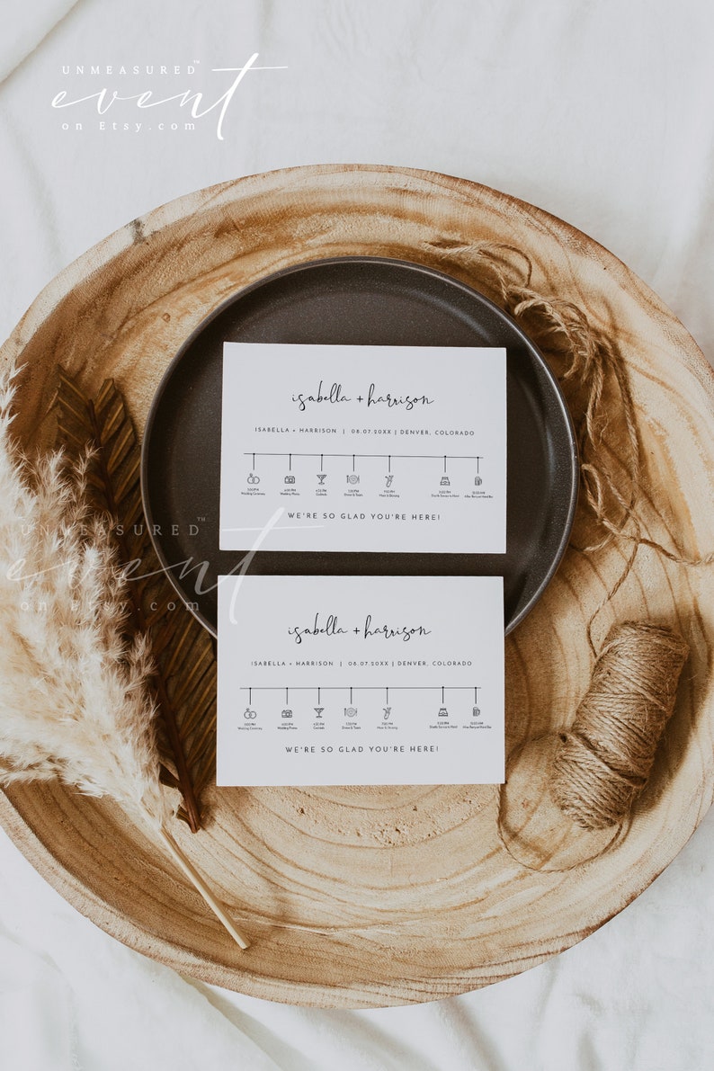 May include: Two white cards with black text and icons. The top card says "isabella + harrison" and the bottom card says "isabella + harrison". Both cards have a timeline with icons representing different events, such as the wedding ceremony, cocktail hour, and dinner. The text at the bottom of each card says "We're so glad you're here!"