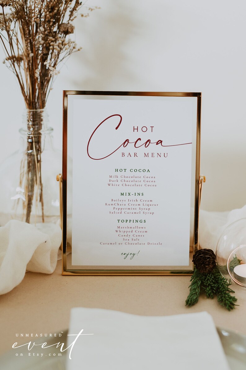 BLAIR Festive Red and Green Modern Christmas Hot Cocoa Bar Menu Sign Printable Template on a holiday table with candles and pine branches