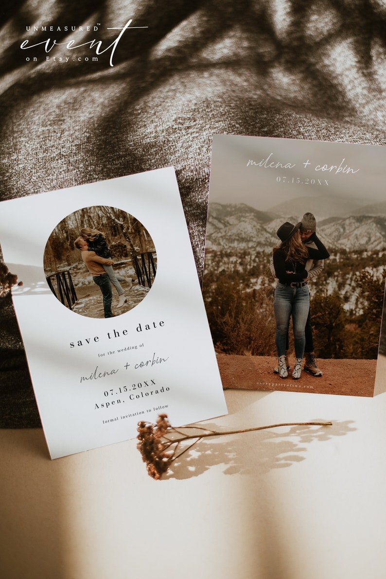 May include: Save the date card with a white background and a circle cutout featuring a couple in a snowy landscape. The text reads "Save the date for the wedding of milena + corbin 07.15.20XX Aspen, Colorado formal invitation to follow".
