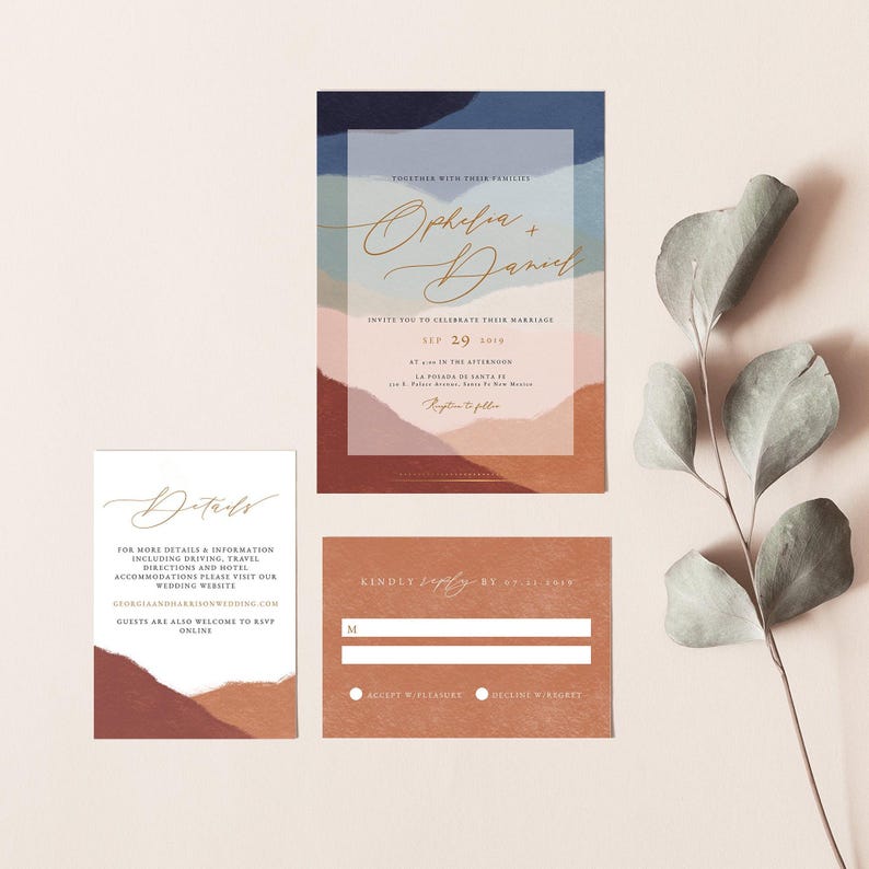 May include: A wedding invitation suite with an abstract watercolor background in shades of blue, pink, and brown. The invitation features the couple's names, "Ophelia + Daniel", and the wedding date, "Sep 29, 2019". The RSVP card includes a space for the guest's name and a choice to accept with pleasure or decline with regret.