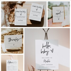 Puede incluir: Un conjunto de carteles imprimibles para baby shower con un dise&ntilde;o moderno y minimalista. Los carteles presentan texto en caligraf&iacute;a negra sobre un fondo blanco con un s&iacute;mbolo de coraz&oacute;n. Los carteles incluyen "Hola, beb&eacute;", "Bienvenido a la baby shower de Marlo", "Los beb&eacute;s son dulces", "Gracias desde el fondo de nuestros corazones", "Un libro para beb&eacute;" y "Consejos y predicciones".