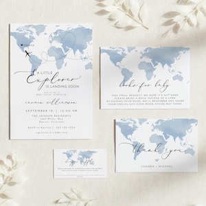 May include: Baby shower invitation set with a world map design in shades of blue. The invitation reads "A Little Explorer is Landing Soon" with event details. Additional cards include "Books for Baby" and "Thank You".