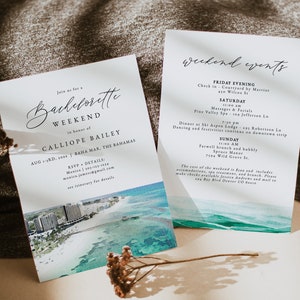 May include: A watercolour illustration of a beach scene with a cityscape in the background. The text on the card reads "Join us for a Bachelorette Weekend in honour of Calliope Bailey Aug 1-3rd, 20XX Baha Mar, The Bahamas RSVP Details: Monica 303-123-1234 monica.jamess@gmail.com see itinerary for details".