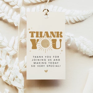 May include: A beige thank you tag with gold text that reads "Thank You" with a sun graphic. The text below reads "Thank you for joining us and making today so very special!"