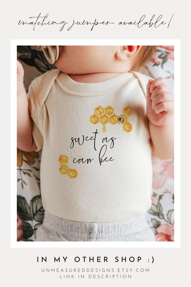 May include: A white baby onesie with a bee and honeycomb design. The onesie says "sweet as can bee".