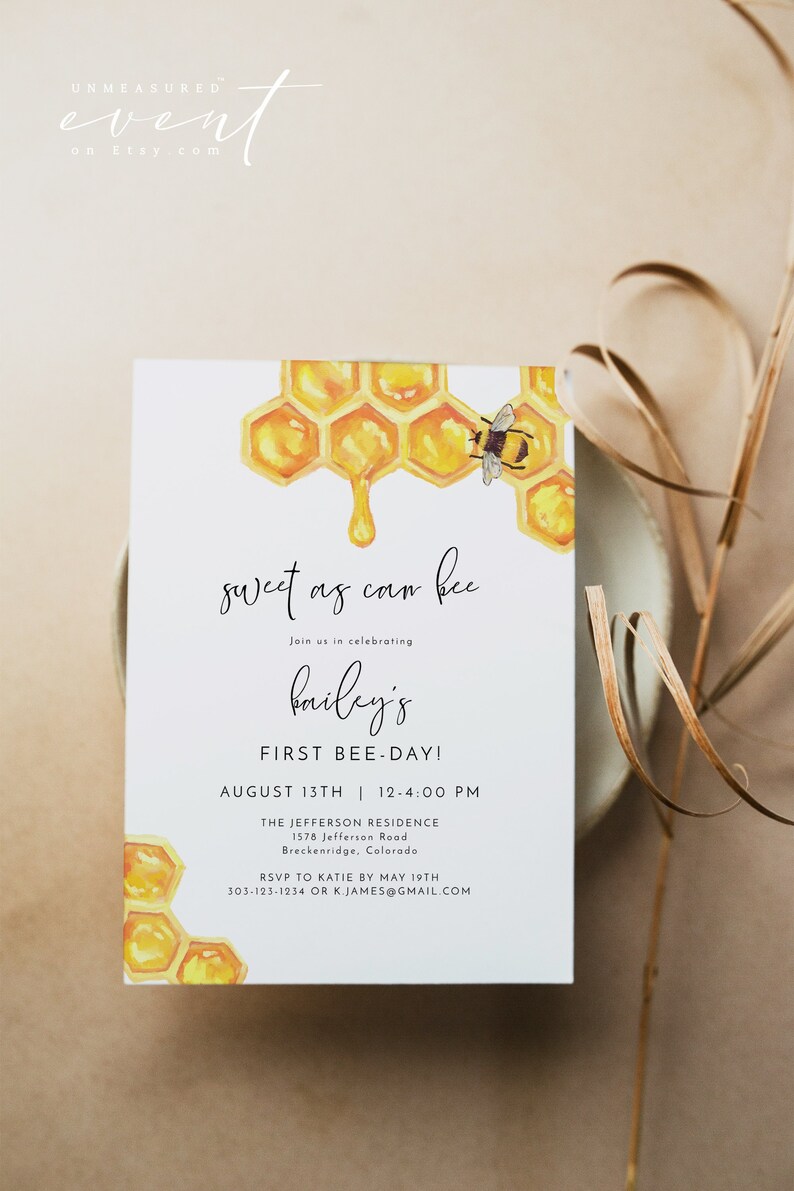 May include: A watercolor illustration of a honeycomb with a dripping honey drop and a bee on top. The invitation reads "sweet as can bee" and is for Bailey's First Bee-Day on August 13th from 12:00 PM to 4:00 PM at The Jefferson Residence, 1578 Jefferson Road, Breckenridge, Colorado. RSVP to Katie by May 19th at 303-123-1234 or k.james@gmail.com.