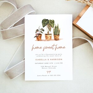 May include: A housewarming party invitation with a watercolor illustration of three potted plants. The invitation reads "home sweet home" and includes the names Isabella & Harrison, the date and time of the party, the address, and a phone number.