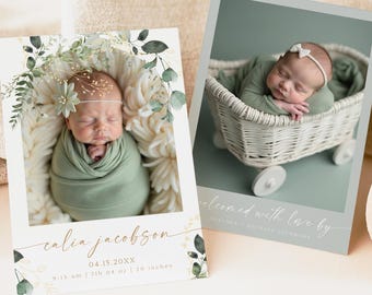 May include: A white card with a green floral border and a photo of a baby girl sleeping in a white blanket. The card reads "calia jacobson" and includes the baby's birth date, time, weight, and length. The card is decorated with gold lettering and green leaves.