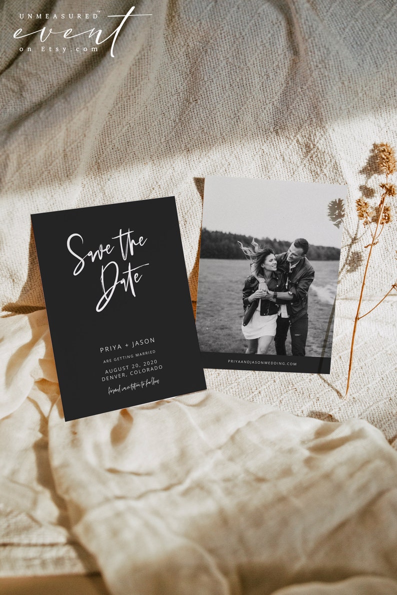 May include: A black and white wedding invitation suite featuring a "Save the Date" card with white script and details for Priya and Jason's wedding in Denver, Colorado. A black and white photo card is also included.