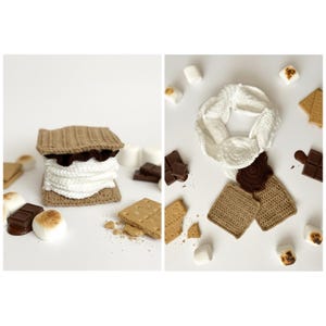 May include: Crocheted s'mores, featuring a square graham cracker base, a chocolate layer, and a fluffy white marshmallow filling. The image also shows a white crocheted infinity scarf, chocolate pieces, graham crackers, and marshmallows.