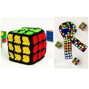 May include: A crocheted Rubik's Cube cover in black, red, yellow, and green. The image also shows a crocheted scarf in the style of a Rubik's Cube, along with several miniature Rubik's Cubes.