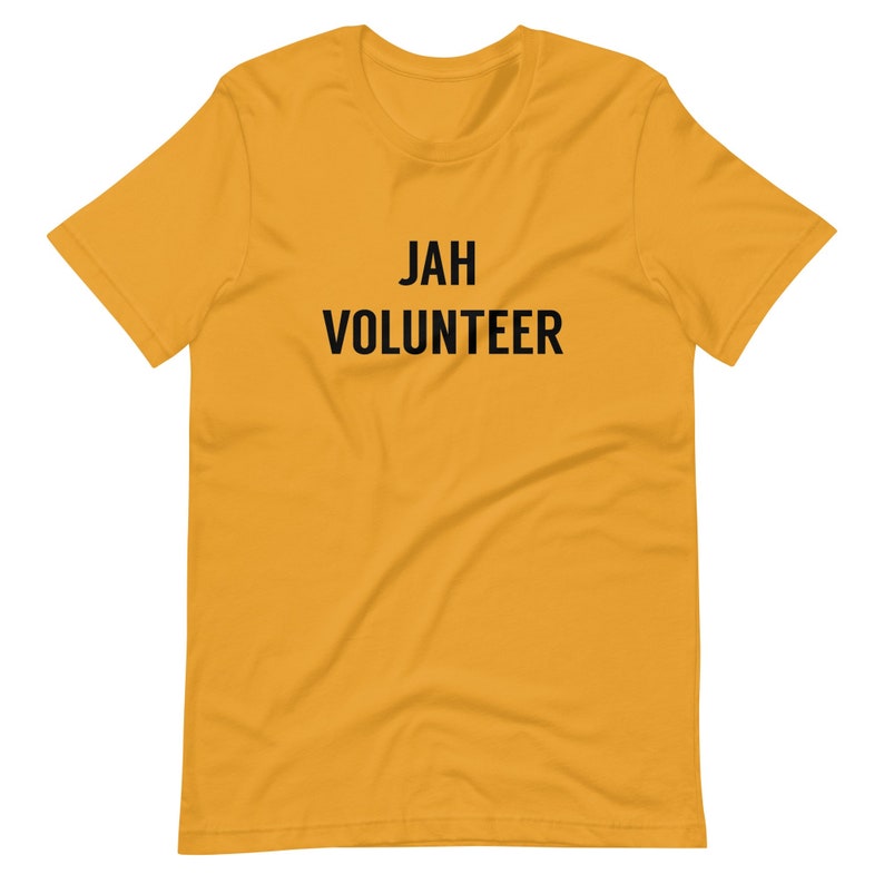 May include: A yellow short-sleeved t-shirt with the text "JAH VOLUNTEER" printed in black.