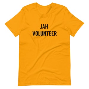 May include: A yellow short-sleeved t-shirt with the text "JAH VOLUNTEER" printed in black.
