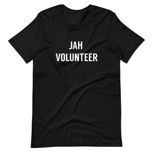 May include: Black t-shirt with white text that reads "JAH VOLUNTEER".