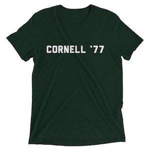 May include: A dark green t-shirt with white text that reads "CORNELL '77".