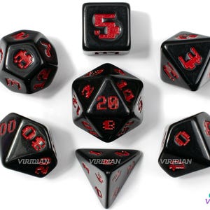 May include: Set of seven black dice with red numbers. The dice are a d4, d6, d8, d10, d%, d12, and d20.