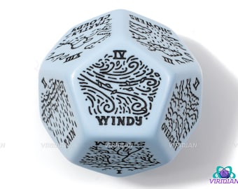 May include: A light blue six-sided dice with black ink illustrations of different weather conditions. The dice has the numbers I through VI on each side. The sides show "Rain", "Overcast", "Windy", "Showers", "Cloudy", and "Fog".