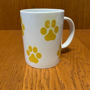 12oz Coffee mug doggy bone and puppy paws. Dishwasher safe.