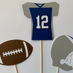 Football centerpiece sticks with personalized jersey.