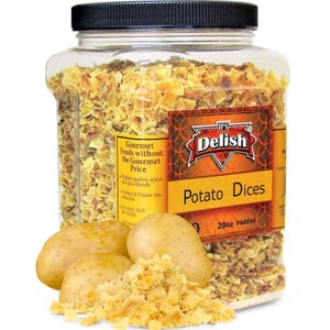 May include: A clear plastic jar filled with dried potato dices. The jar has a black lid and a label that reads "It's Delish Potato Dices 200z Pareve". Three whole potatoes are in the foreground.