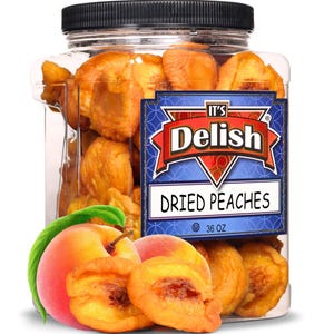 May include: A clear plastic jar filled with dried peaches, labeled "It's Delish" and "Dried Peaches." Fresh peaches and peach slices are in front of the jar. The jar has a black lid and contains 36 oz of dried peaches.